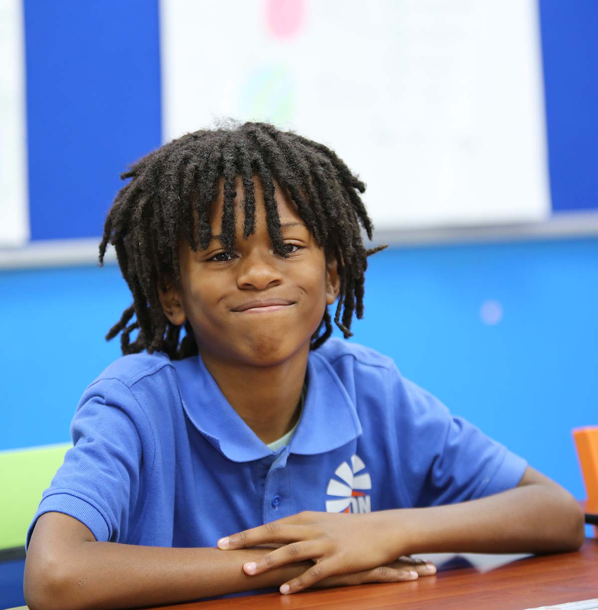 Student drawing in a classroom.
